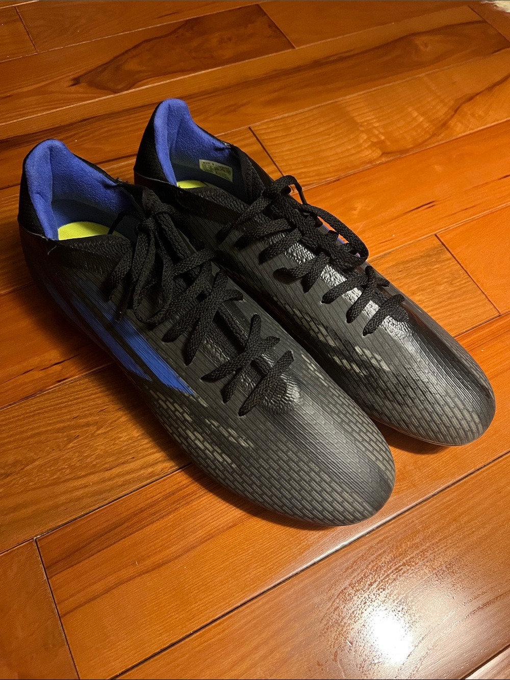 Black Soccer Cleats with Blue Accents